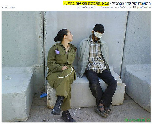 Israeli Soldier Eden Abergil Facebook photo - Eden Aberjil sitting legs crossed